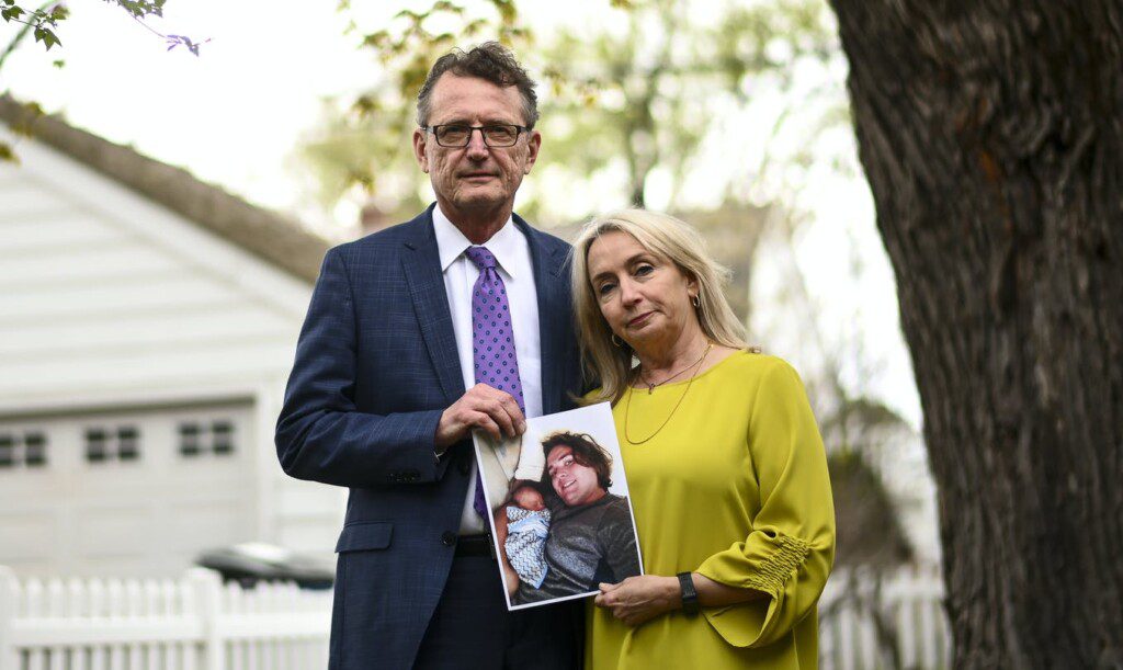 Max Tillett's parents hold a photo